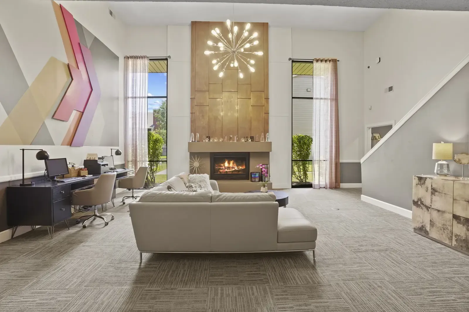 Stylish community lounge with seating and a fireplace
