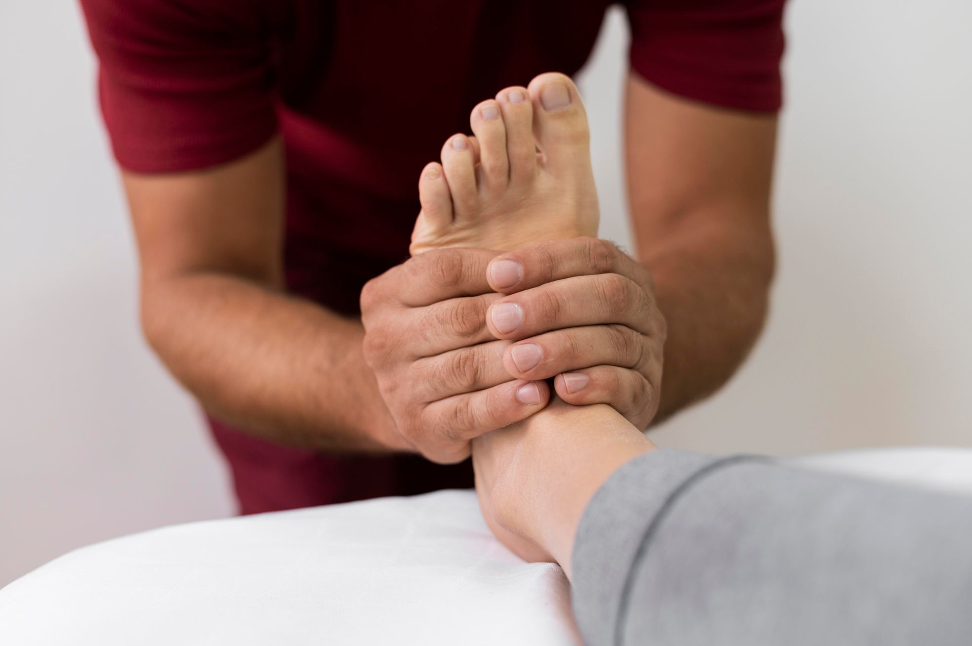 A man is giving a foot massage to a woman.