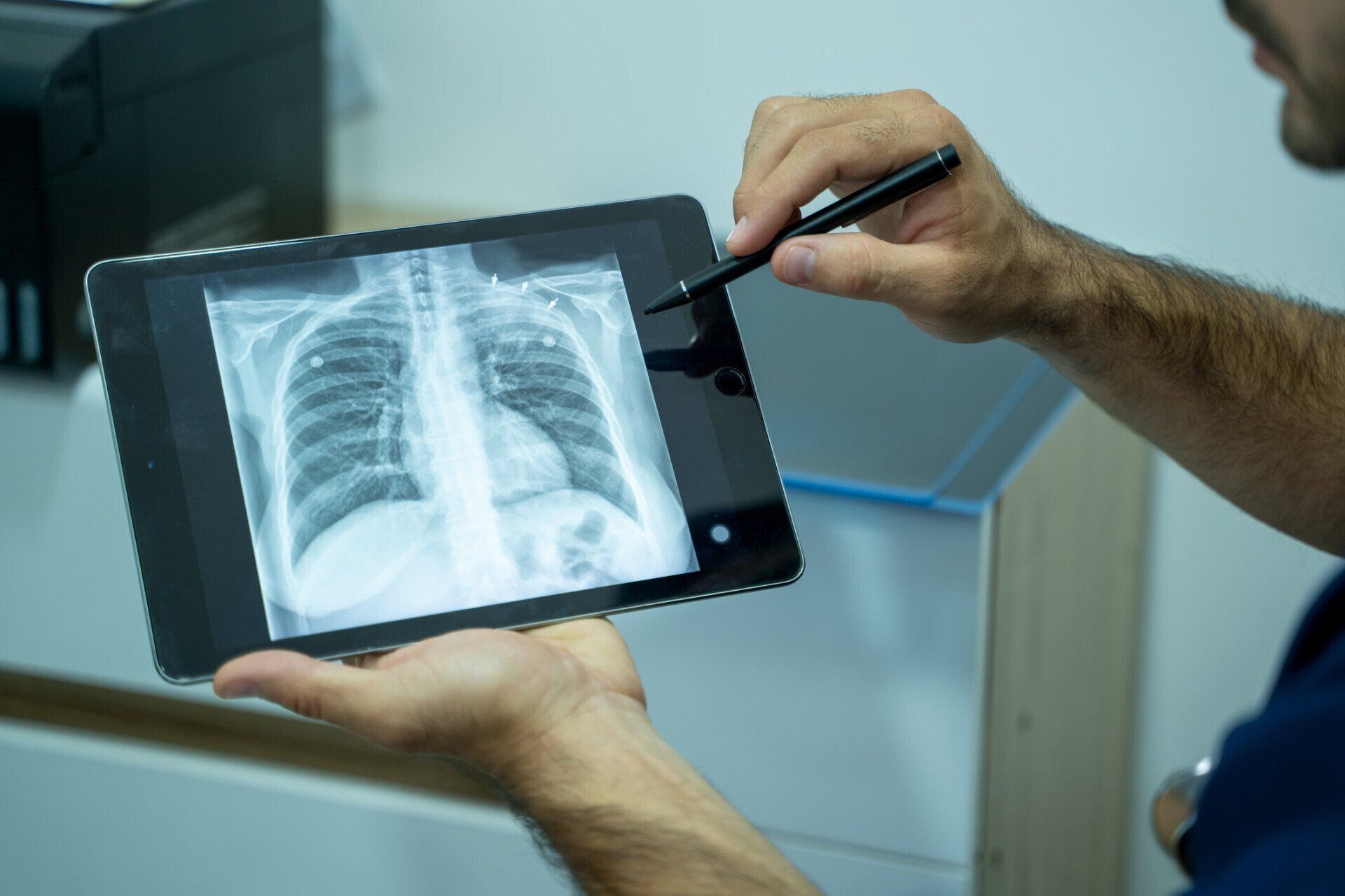 Doctor Explaining The Results Of Scan Lung On Digital Tablet — Costa Mesa, CA — Affiliated Medical Evaluators, Inc.