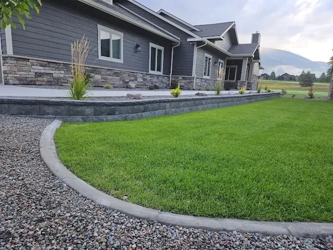 A large house with a lush green lawn in front of it