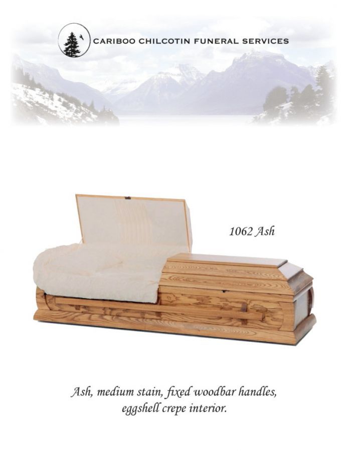 Light wood coffin with white interior, shown in a funeral services ad with mountain logo.