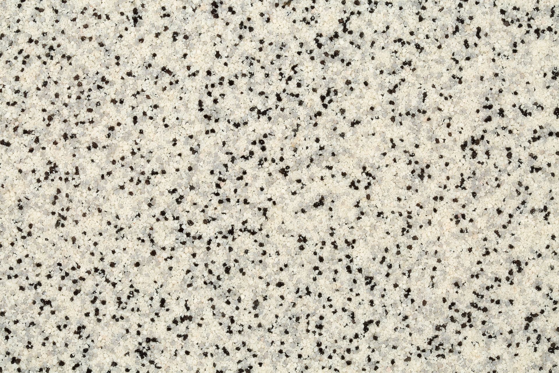 White granite countertop speckled with black and gray flecks.