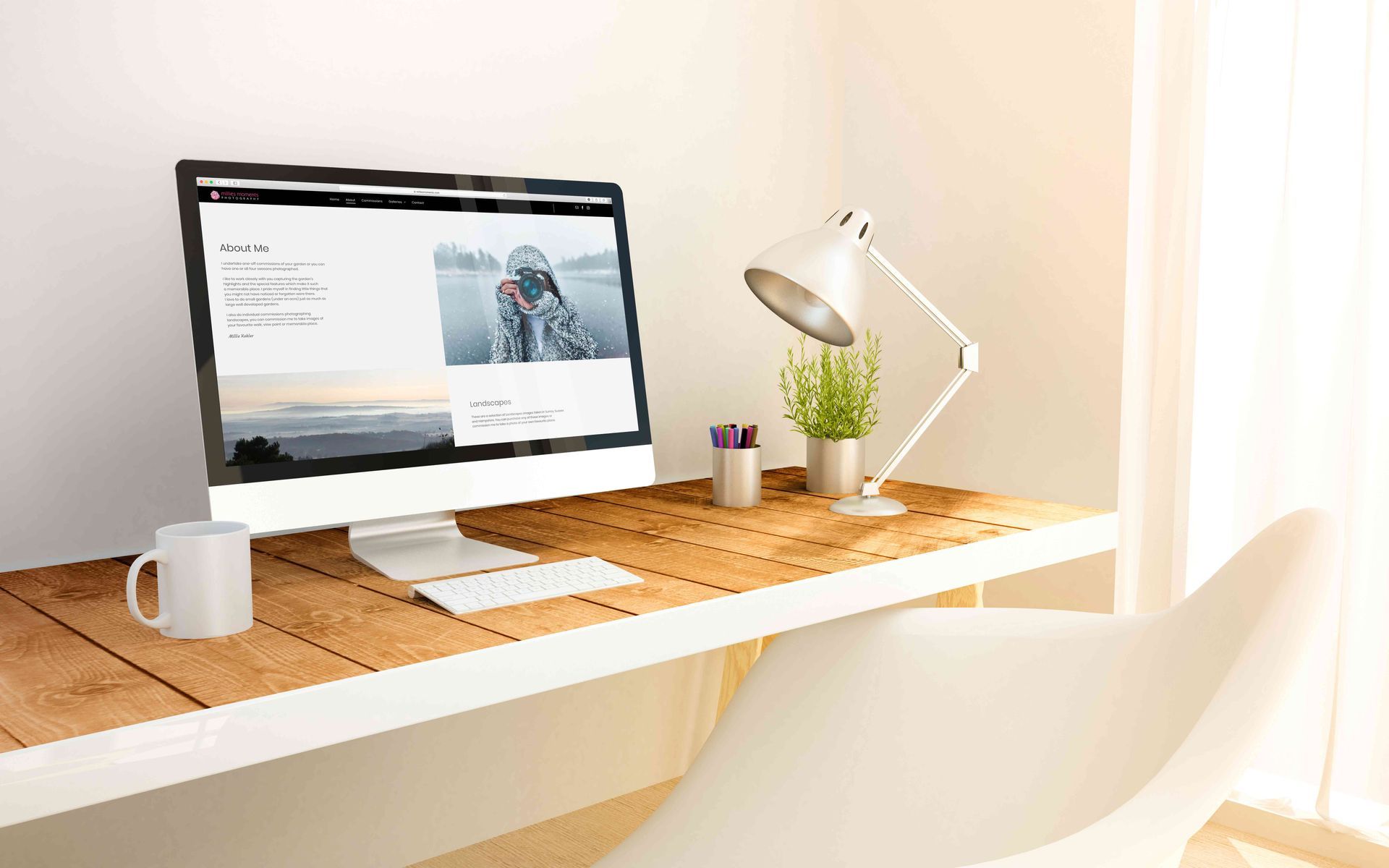 A computer is sitting on a wooden desk next to a lamp.