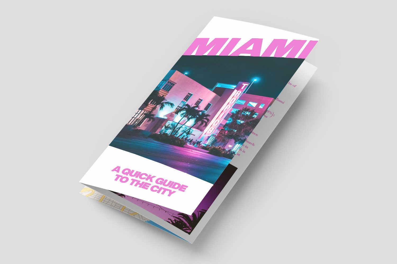 A brochure for miami is sitting on a table.