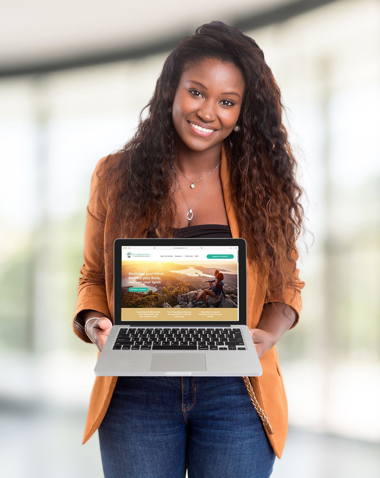 Woman holding computer showing website