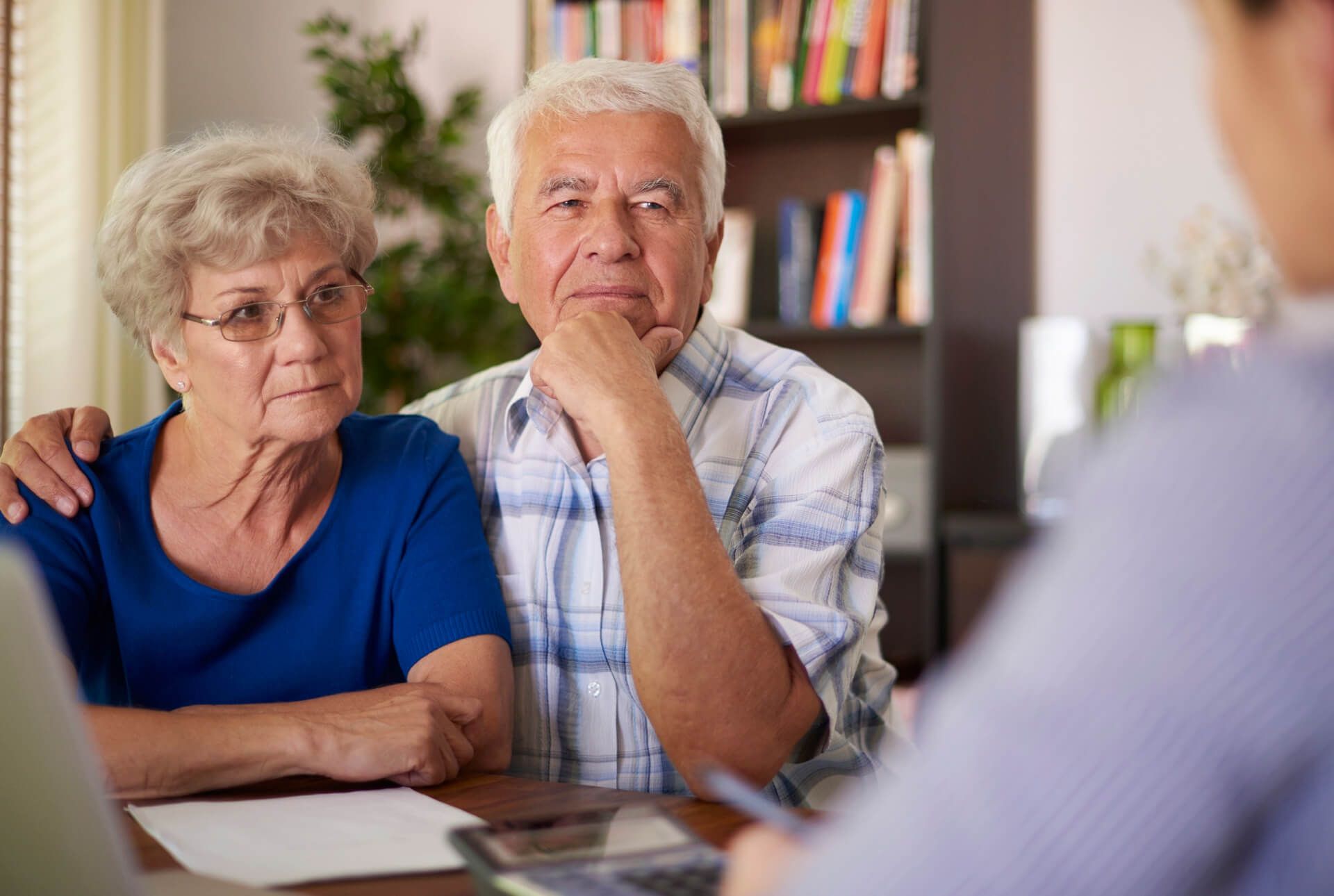 Elderly Couple Talking to Attorney