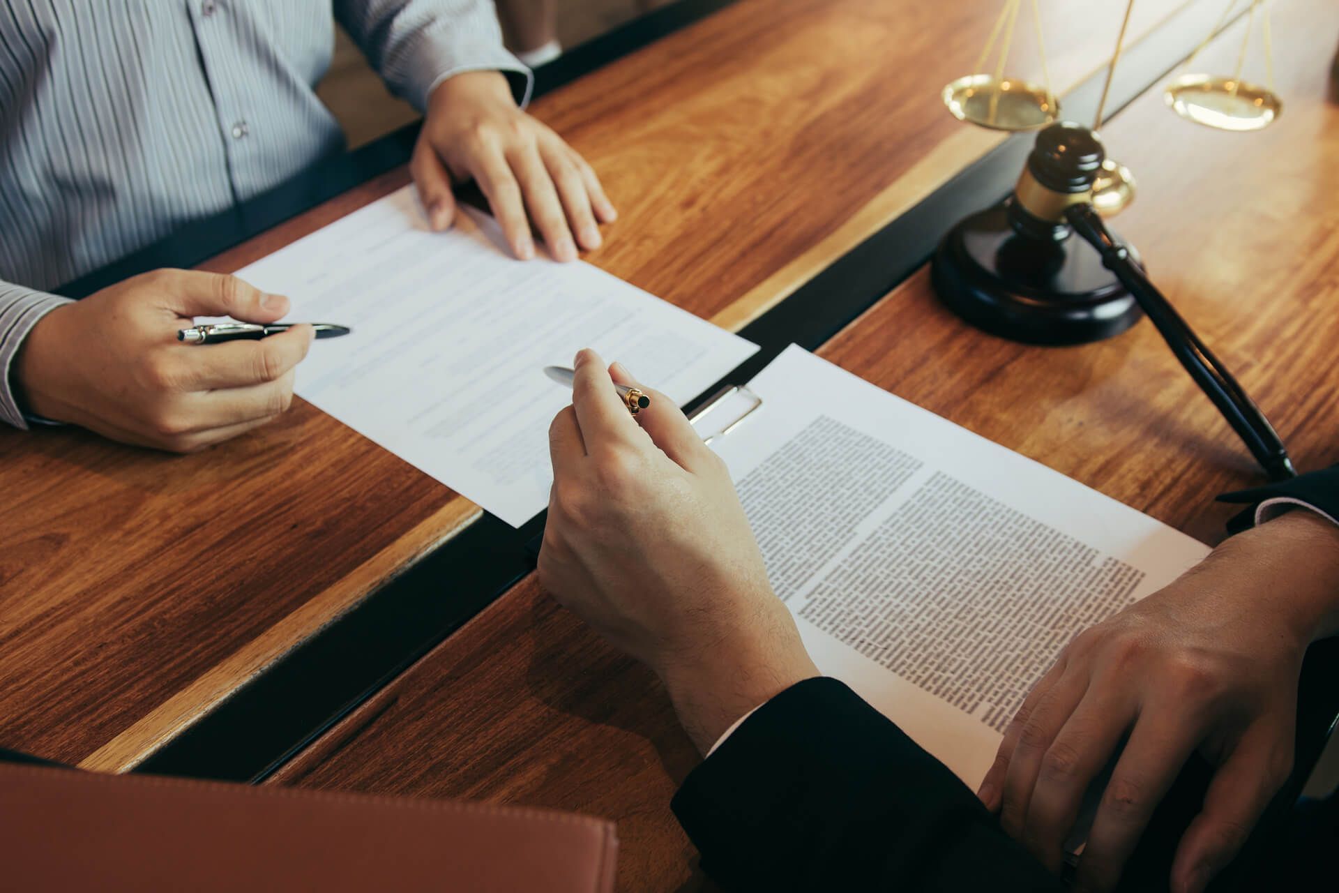 Man and Woman Signing a Document