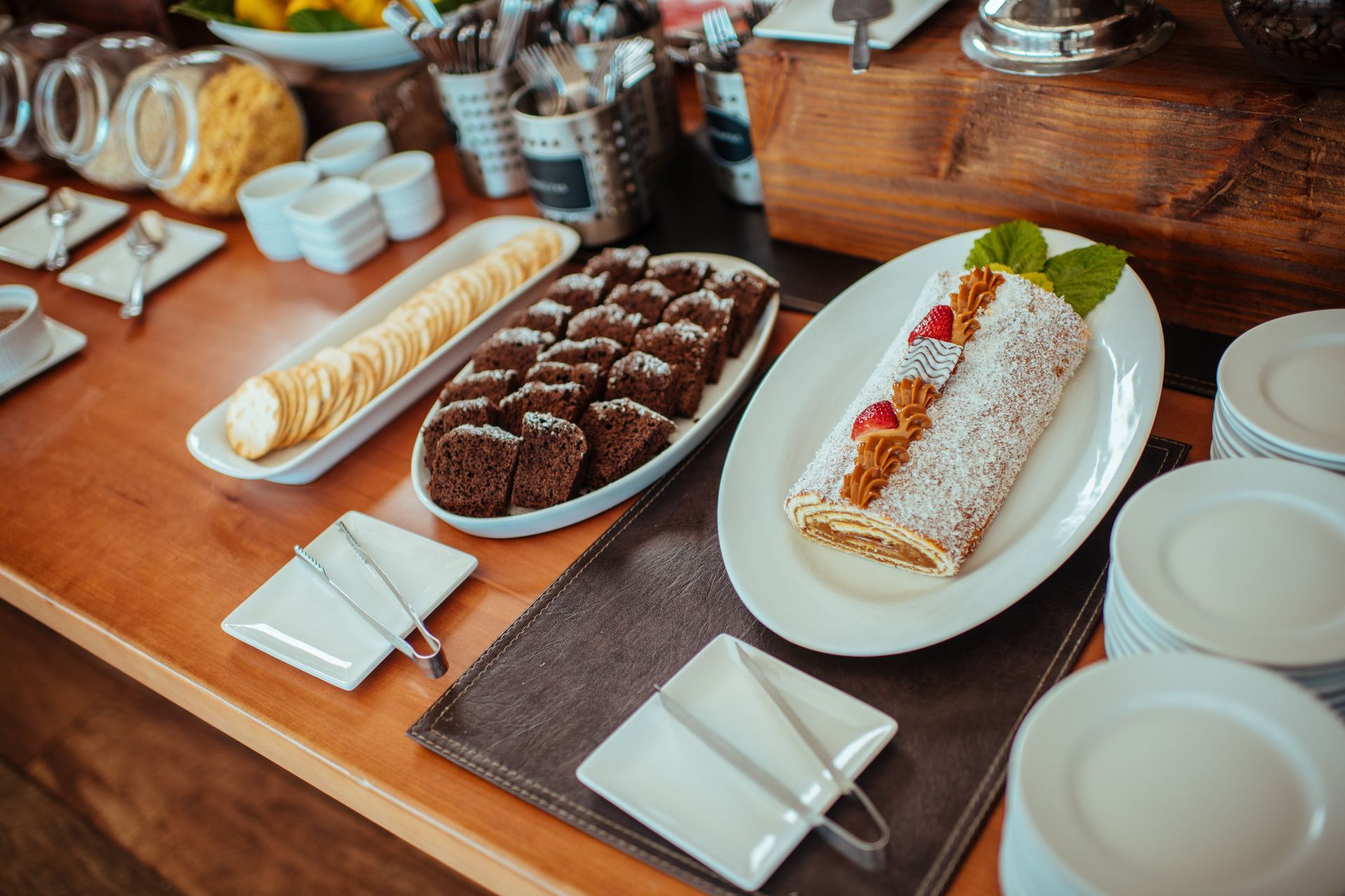 There are many different types of desserts on the table.