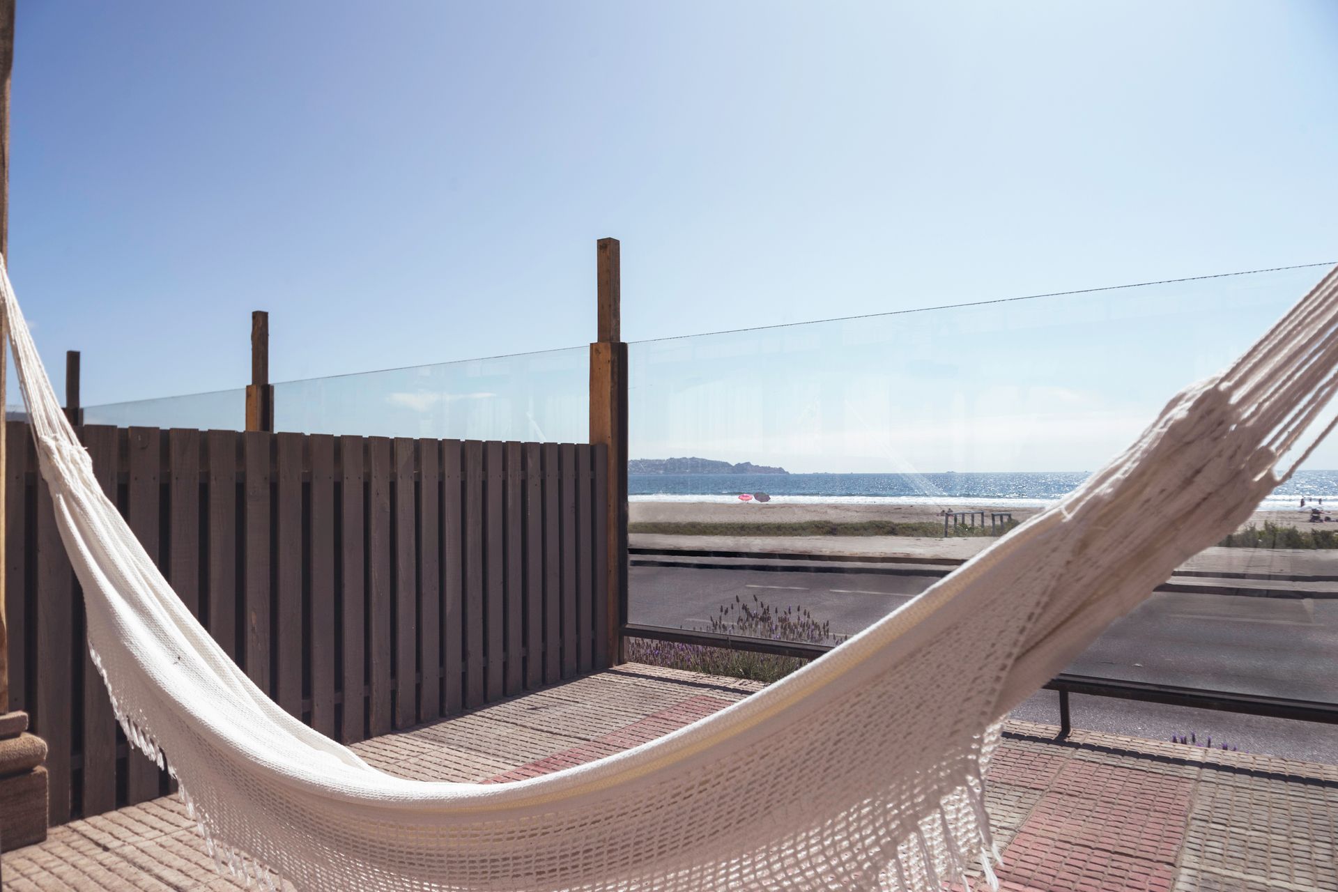 A white hammock with a view of the ocean