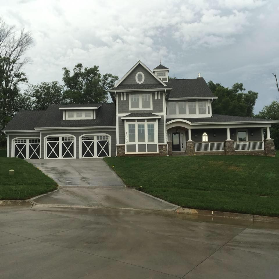 A large house with a driveway leading to it