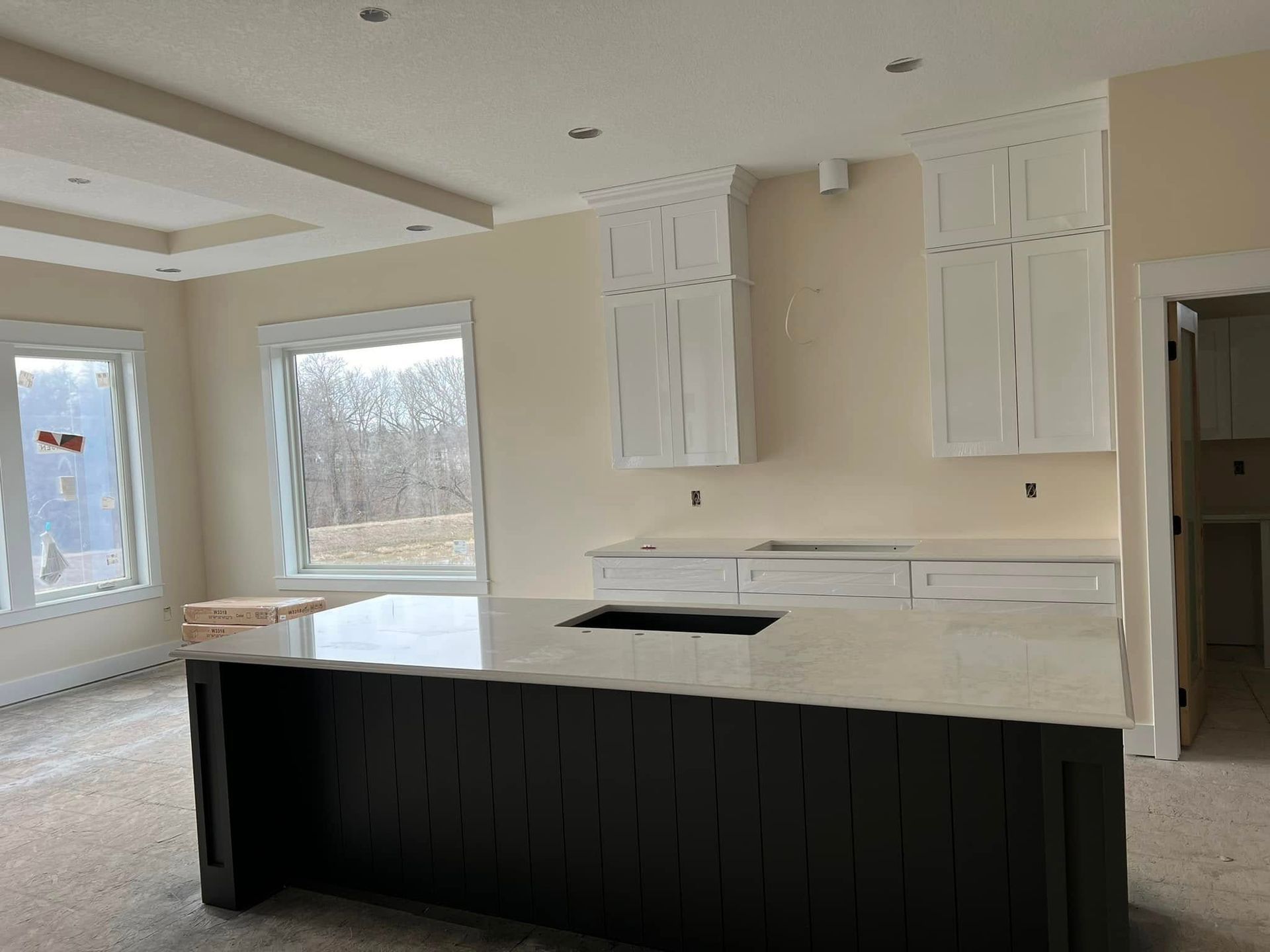 There is a large island in the middle of the kitchen.