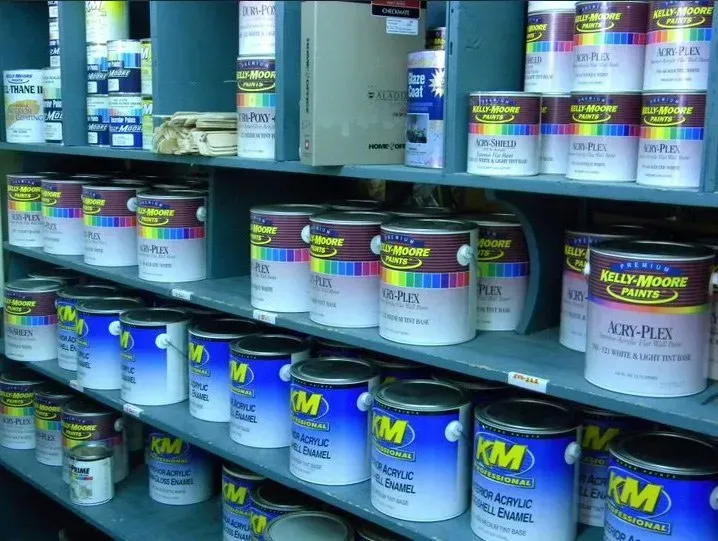 Shelves stocked with various paint cans, primarily blue and white, in a store setting.