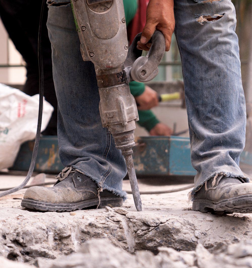 Using Drill To Demolish Floor — Jacksonville, FL — St. Johns Junk Removal