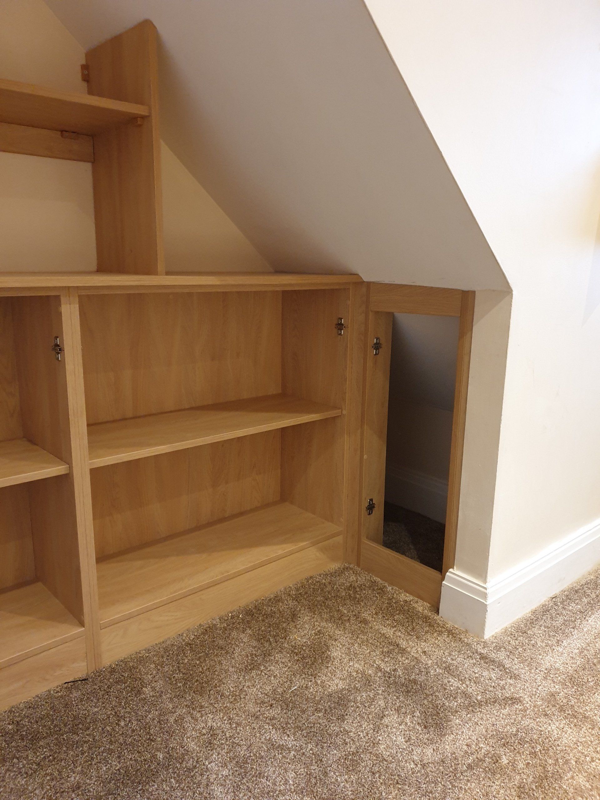 Cupboards And Shelves In The Wasted Space Under Stairs