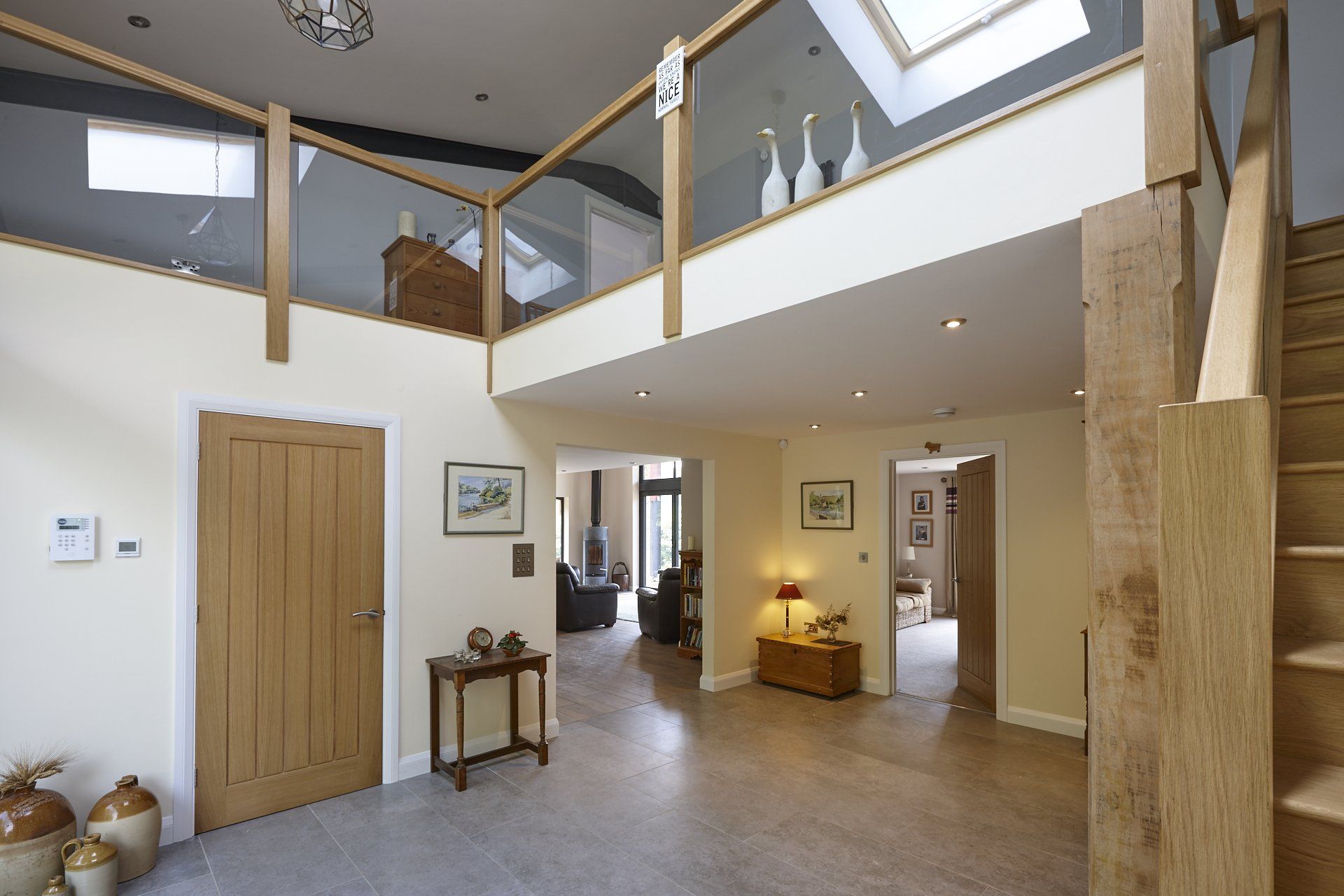 A hallway with stairs leading up to the second floor