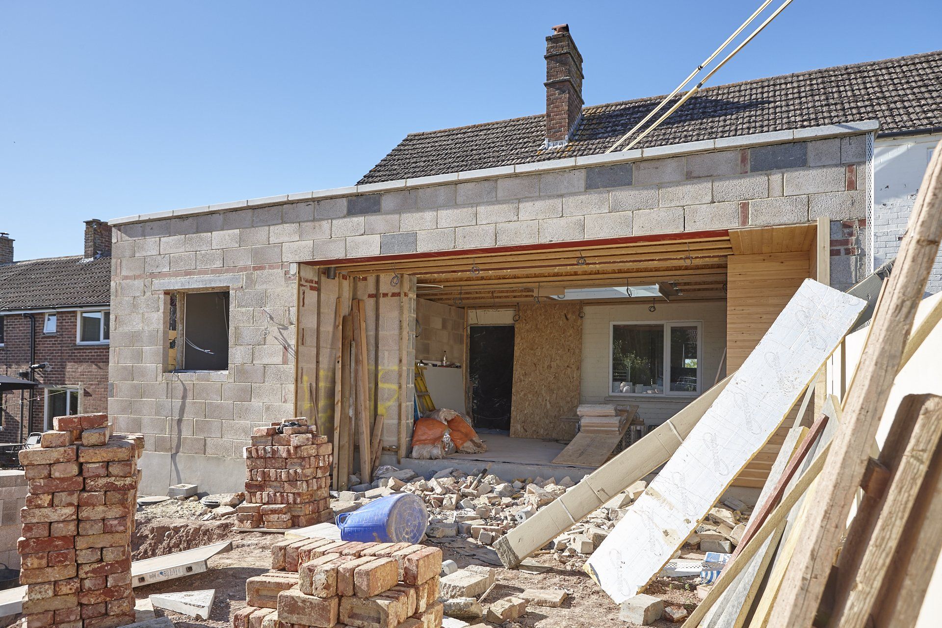 A house is being built with bricks and wood.