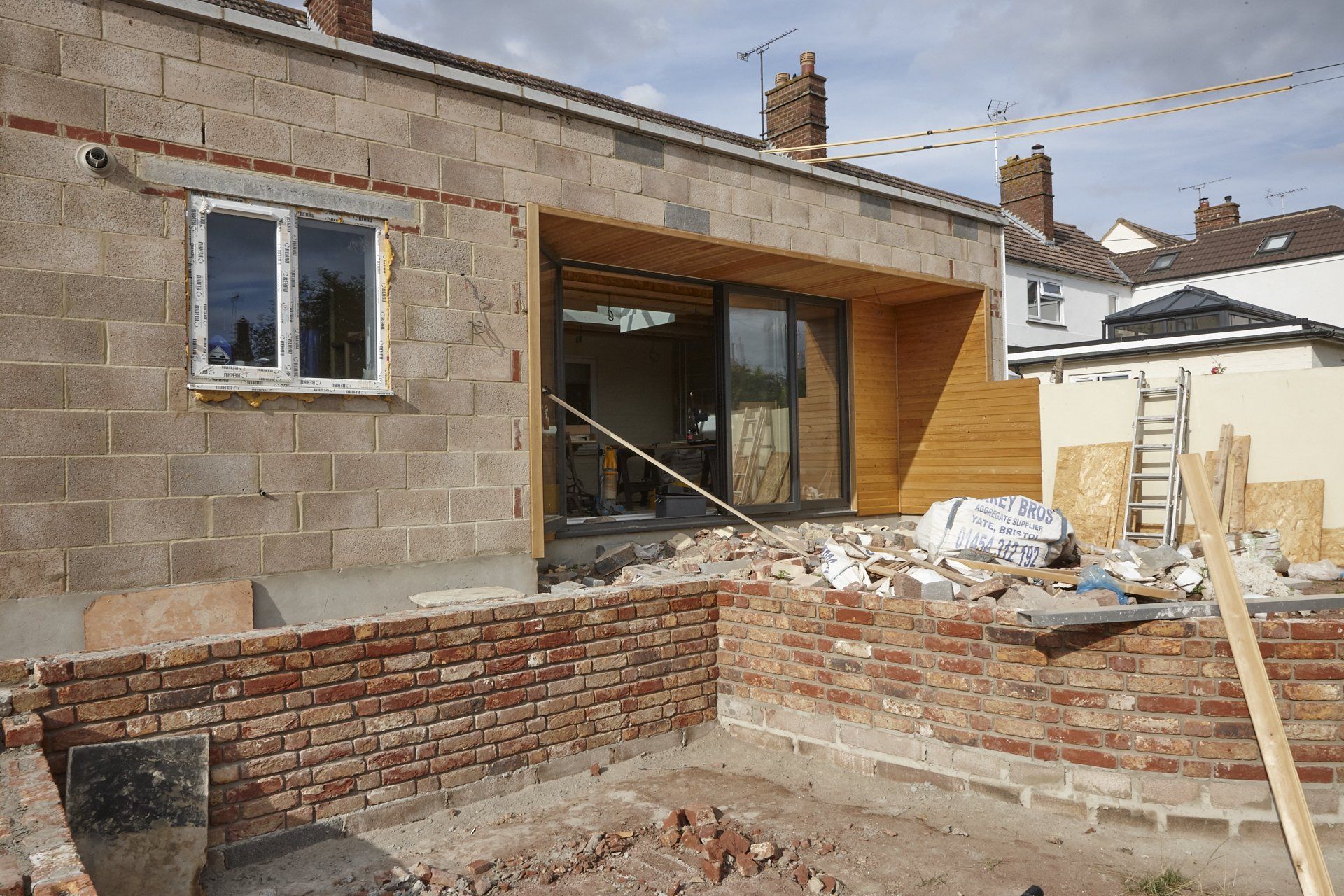 A house is being built with bricks and wood.