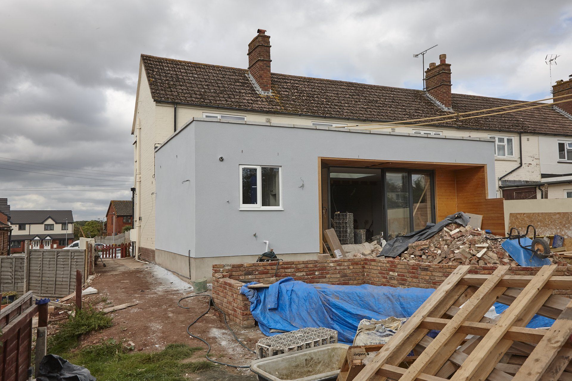A house is being built in the middle of a residential area.
