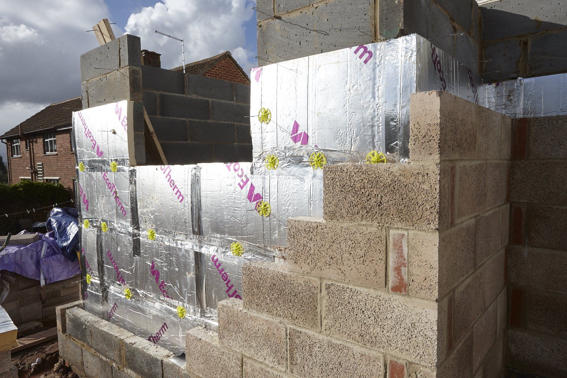 A brick wall with aluminum foil on it