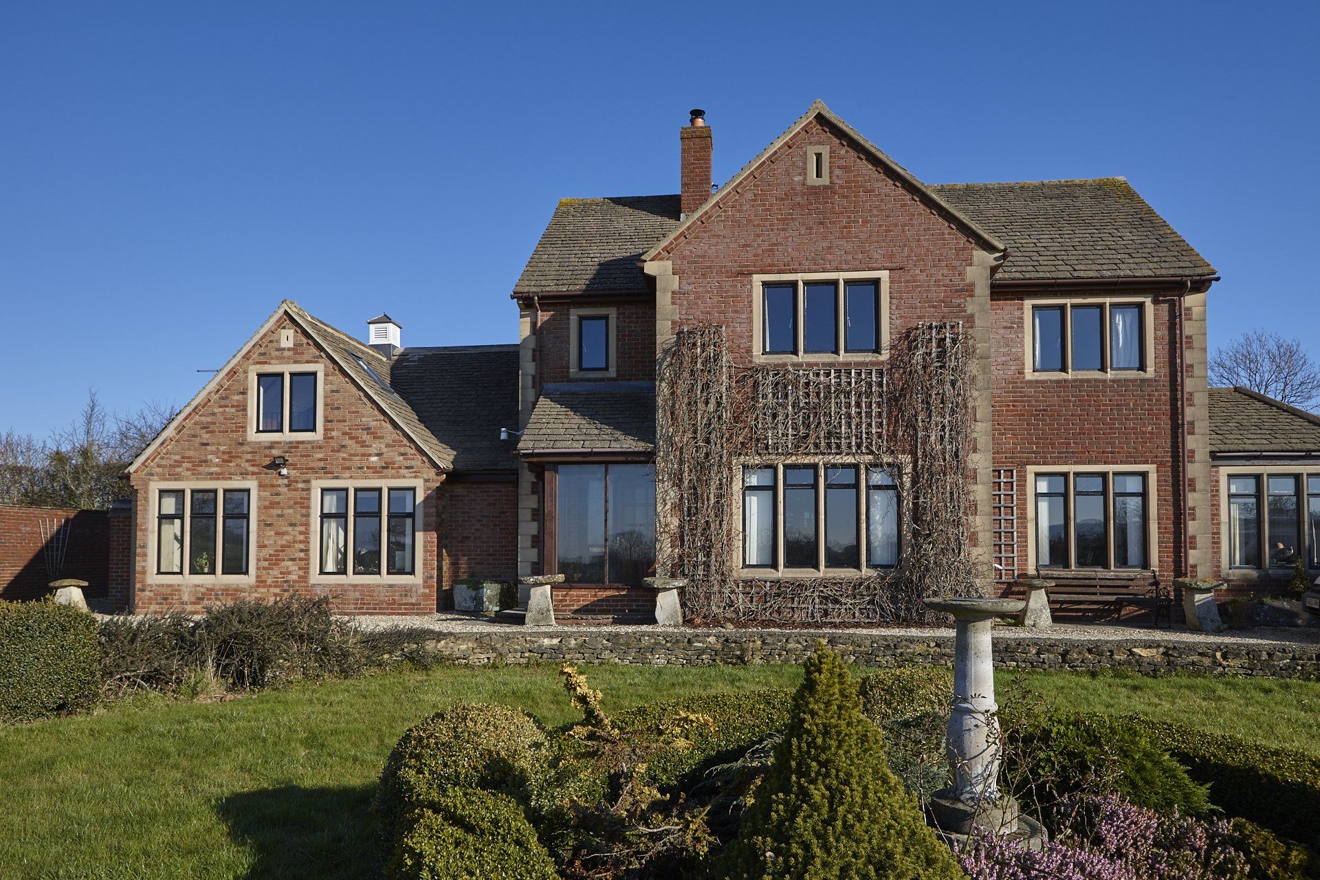 A large brick house with a lot of windows