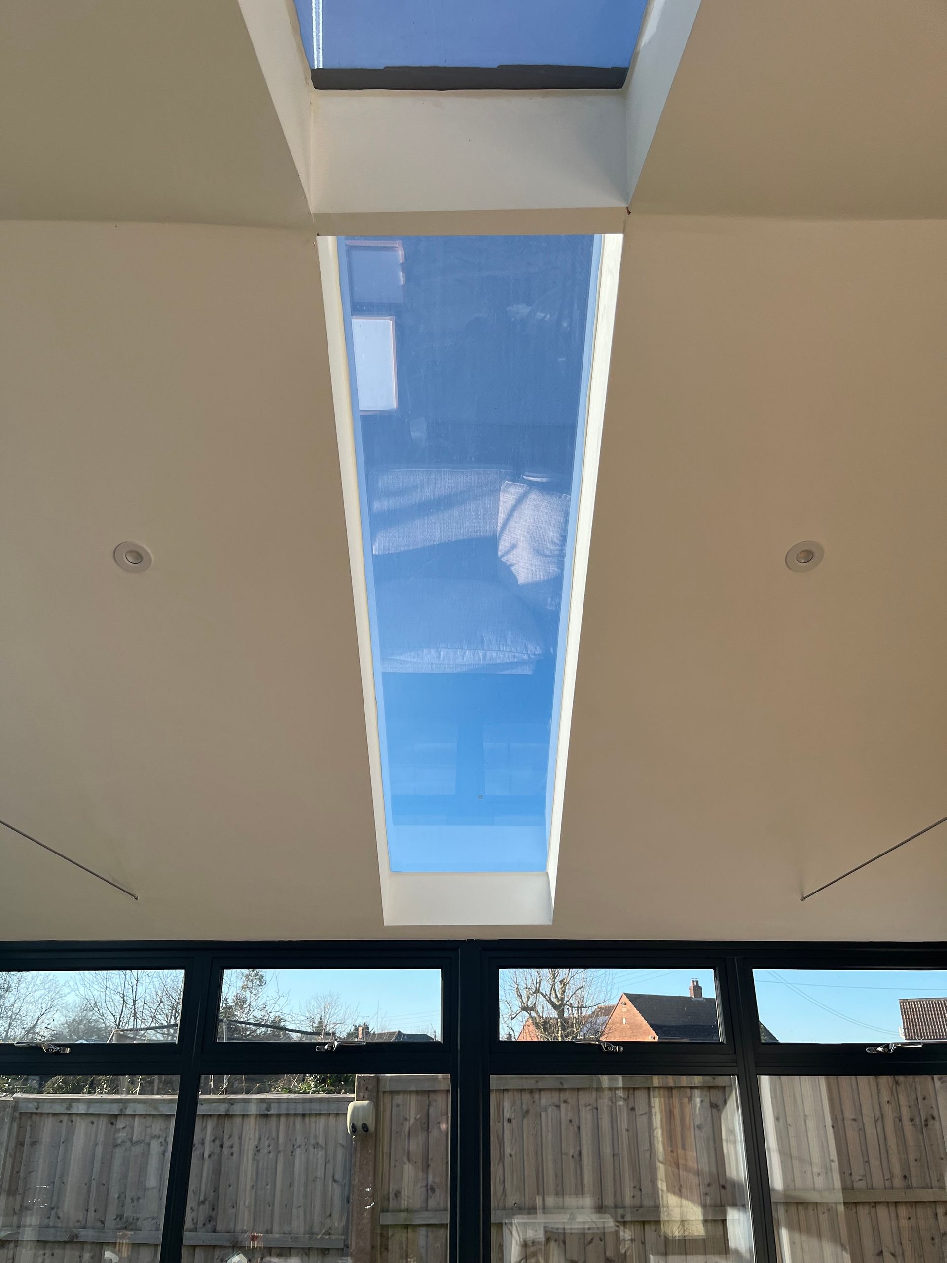 There is a skylight in the ceiling of the room.