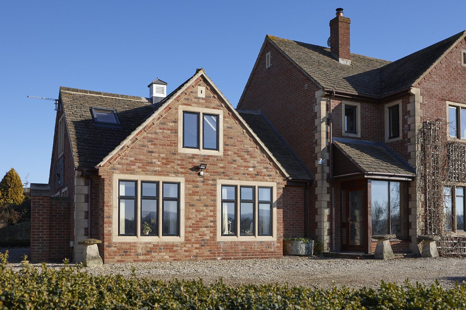 A large brick house with a lot of windows