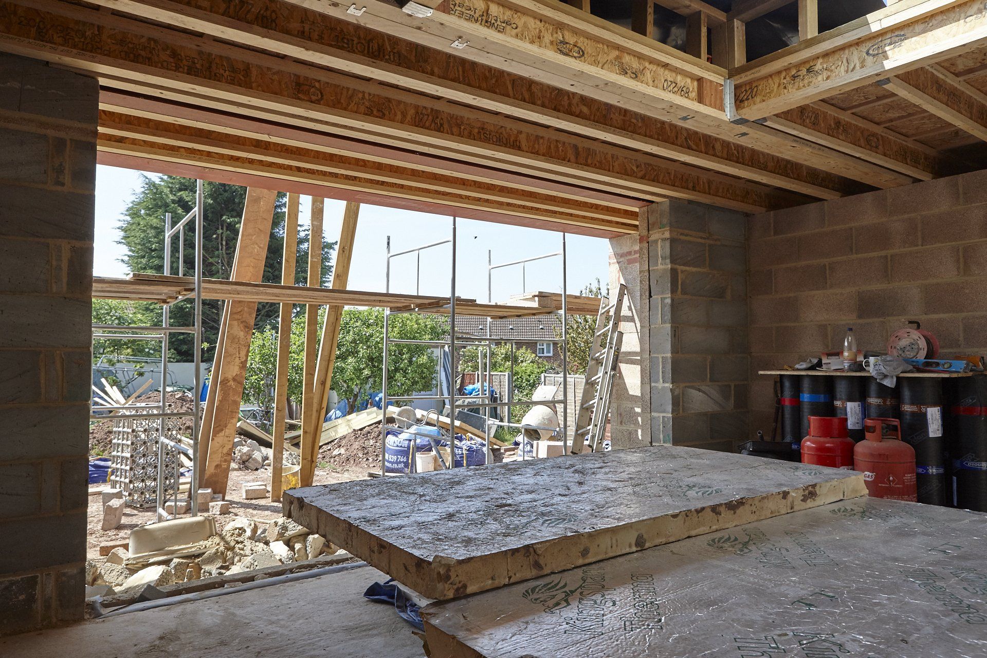 A building under construction with a large window.