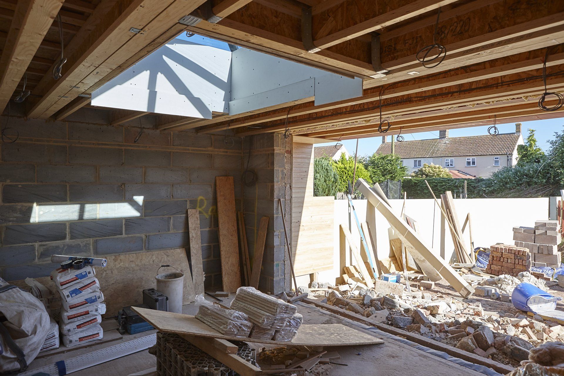 A building under construction with a lot of bricks and wood.