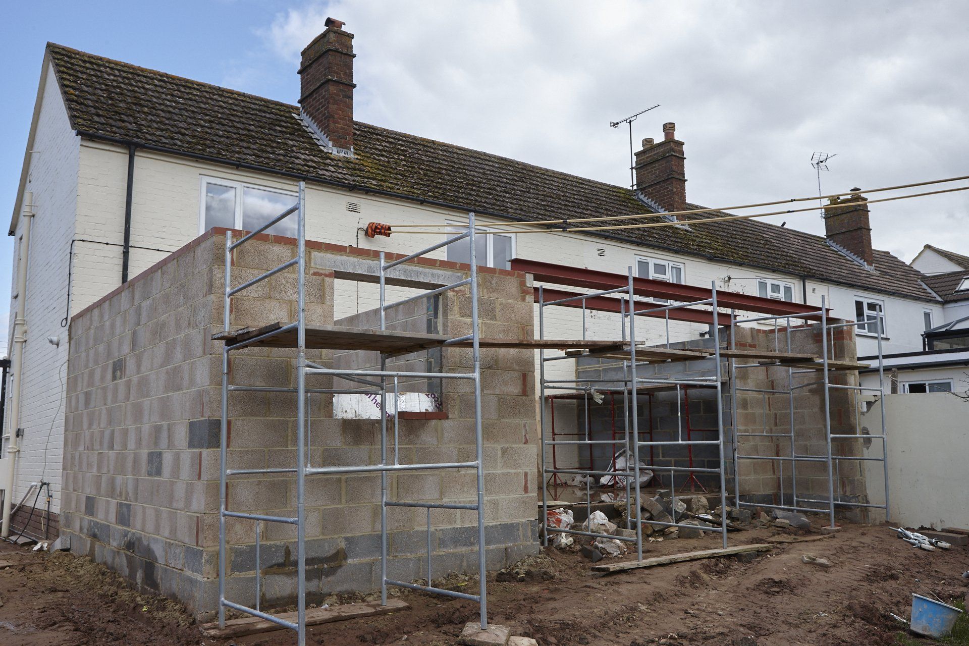 A house is being built with scaffolding around it.