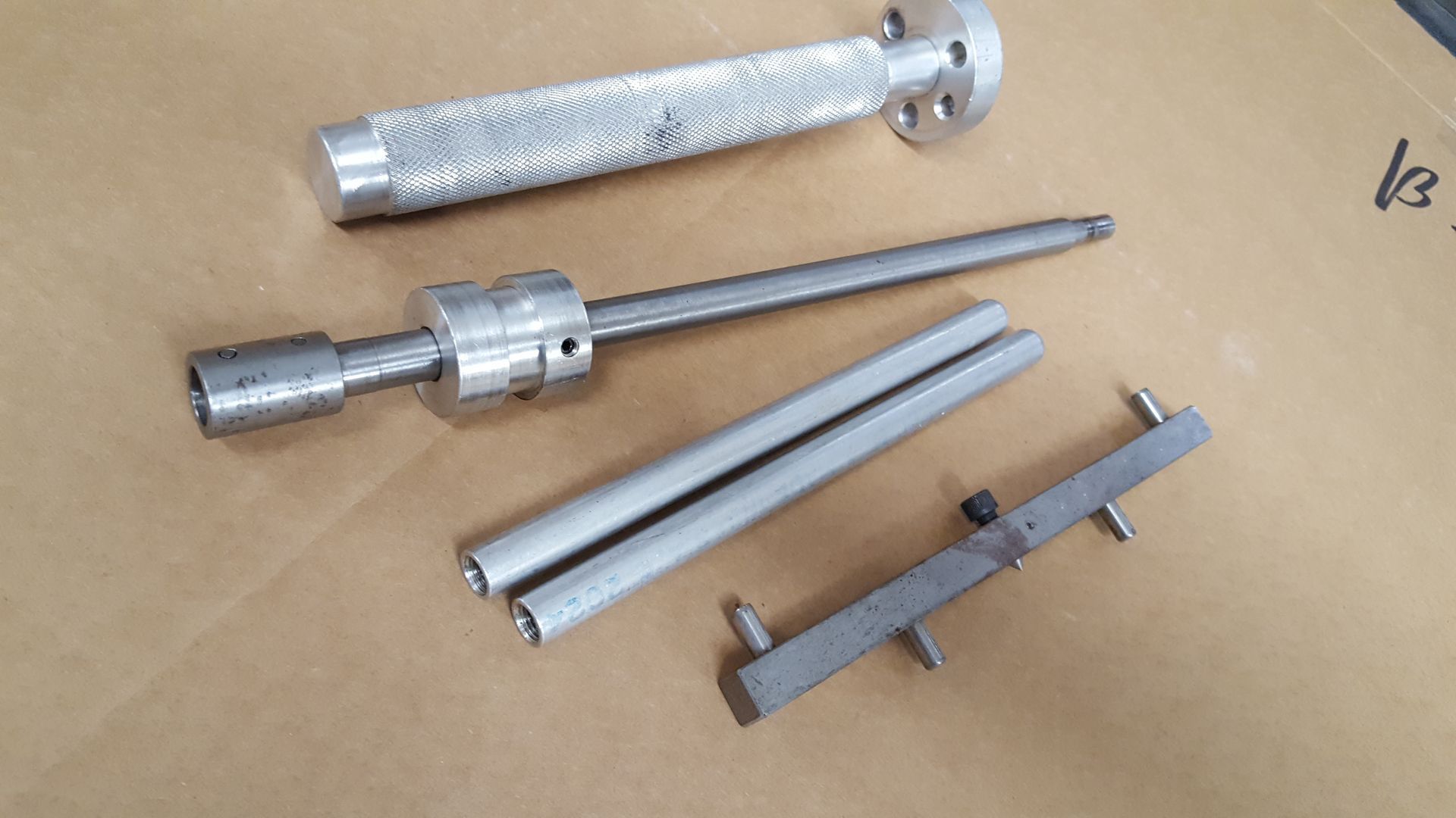 A bunch of metal parts are laying on a table