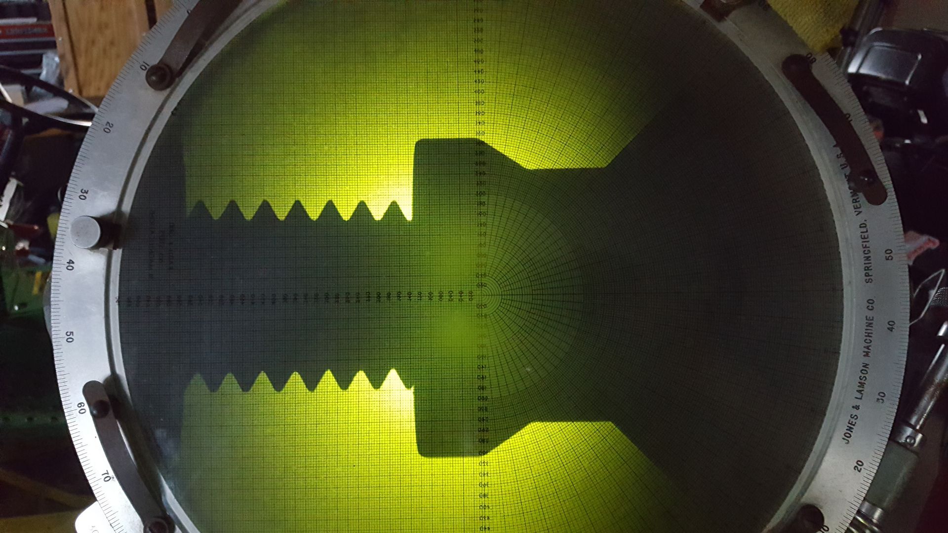 A close up of a circular object with a shadow on it