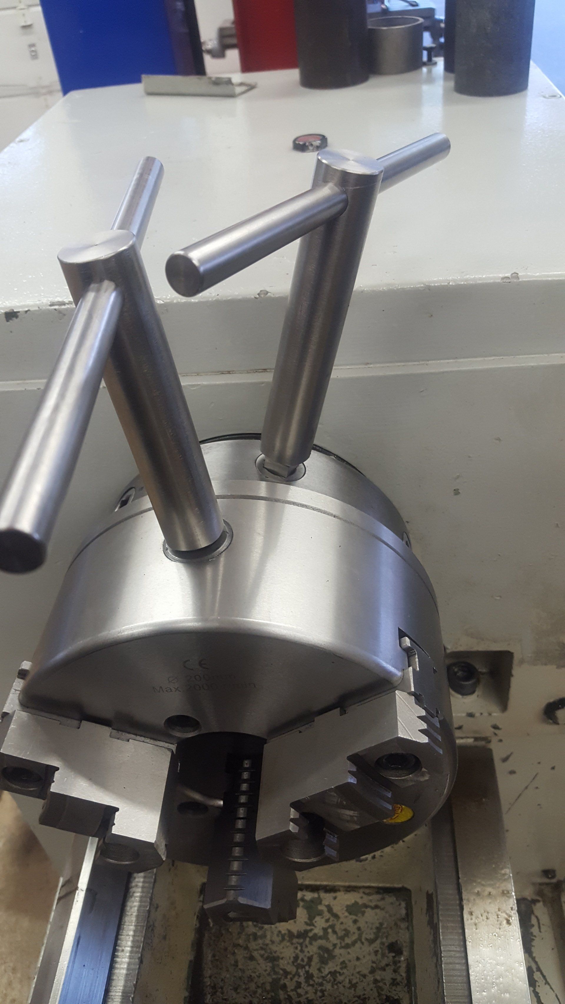 A close up of a lathe with a chuck on it.