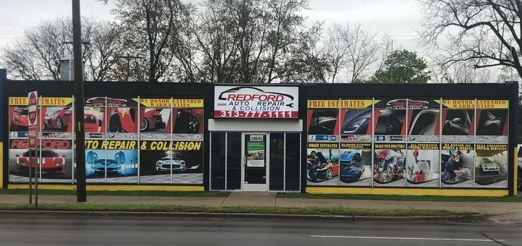A car dealership with a lot of cars in the windows