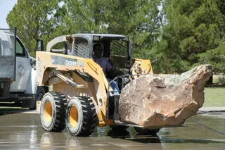 Truck carrying a huge rock — Midland, TX — Franklin Foliage Landscaping