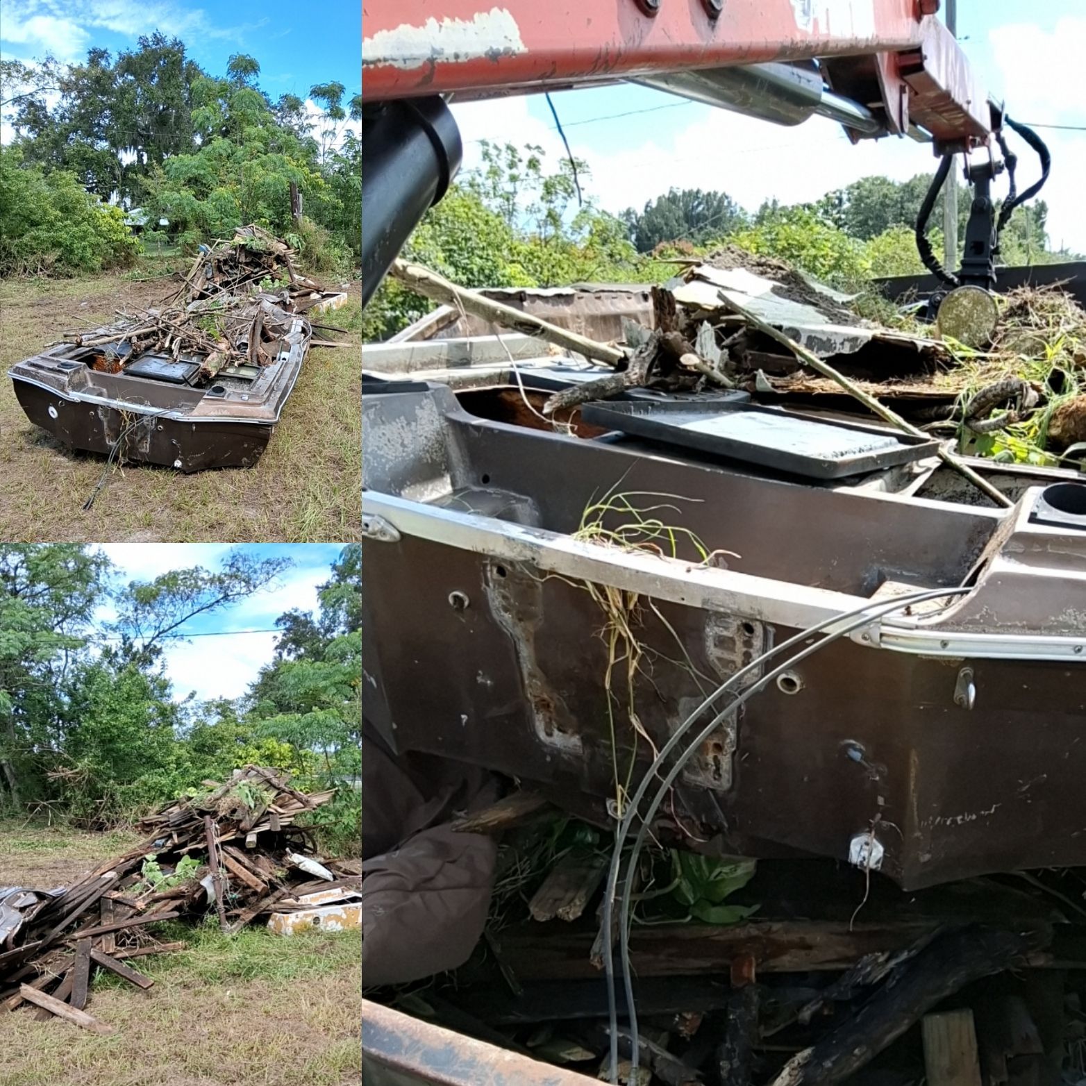 Grapple truck removing a damaged boat and surrounding wood debris during a cleanup project in Davenport, Florida