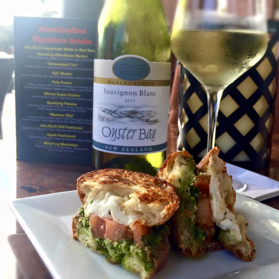 photo of panini and glass of wine