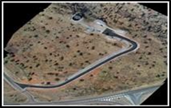 An Aerial View of A Winding Road in A Dry, Brown Landscape — Lamont Civil Services Pty Ltd In Townview, QLD
