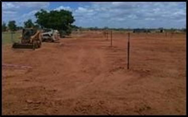 A Wide Open Dirt Field With Construction Equipment Under A Cloudy Sky — Lamont Civil Services Pty Ltd In Townview, QLD