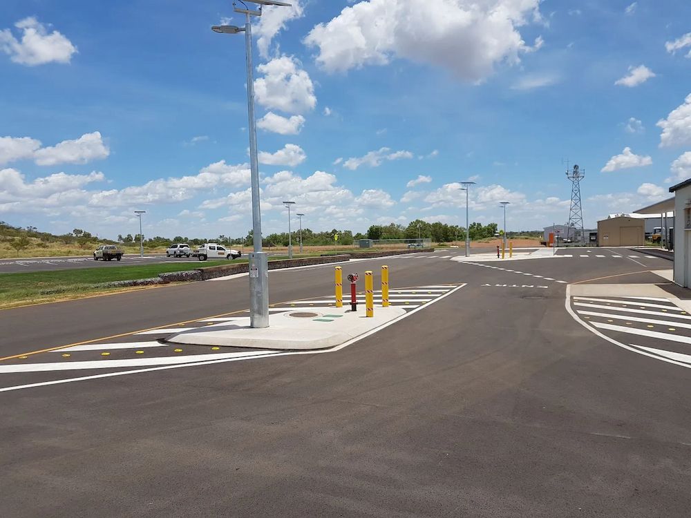 Asphalt Road With Painted Crosswalks and Bollards — Lamont Civil Services Pty Ltd In Townview, QLD