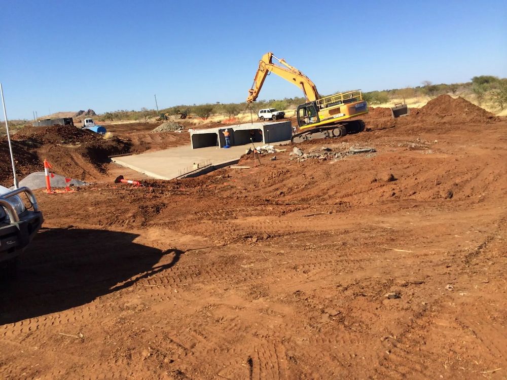 Construction Site With an Excavator Working on a Concrete Structure — Lamont Civil Services Pty Ltd In Cloncurry, QLD