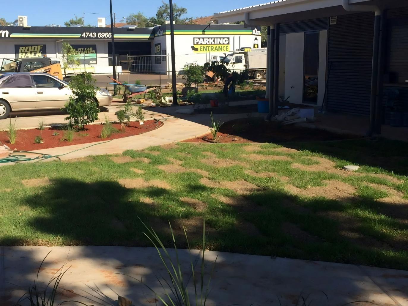 A Paved Walkway Leads Past a Lawn and Landscaped Area — Lamont Civil Services Pty Ltd In Townview, QLD