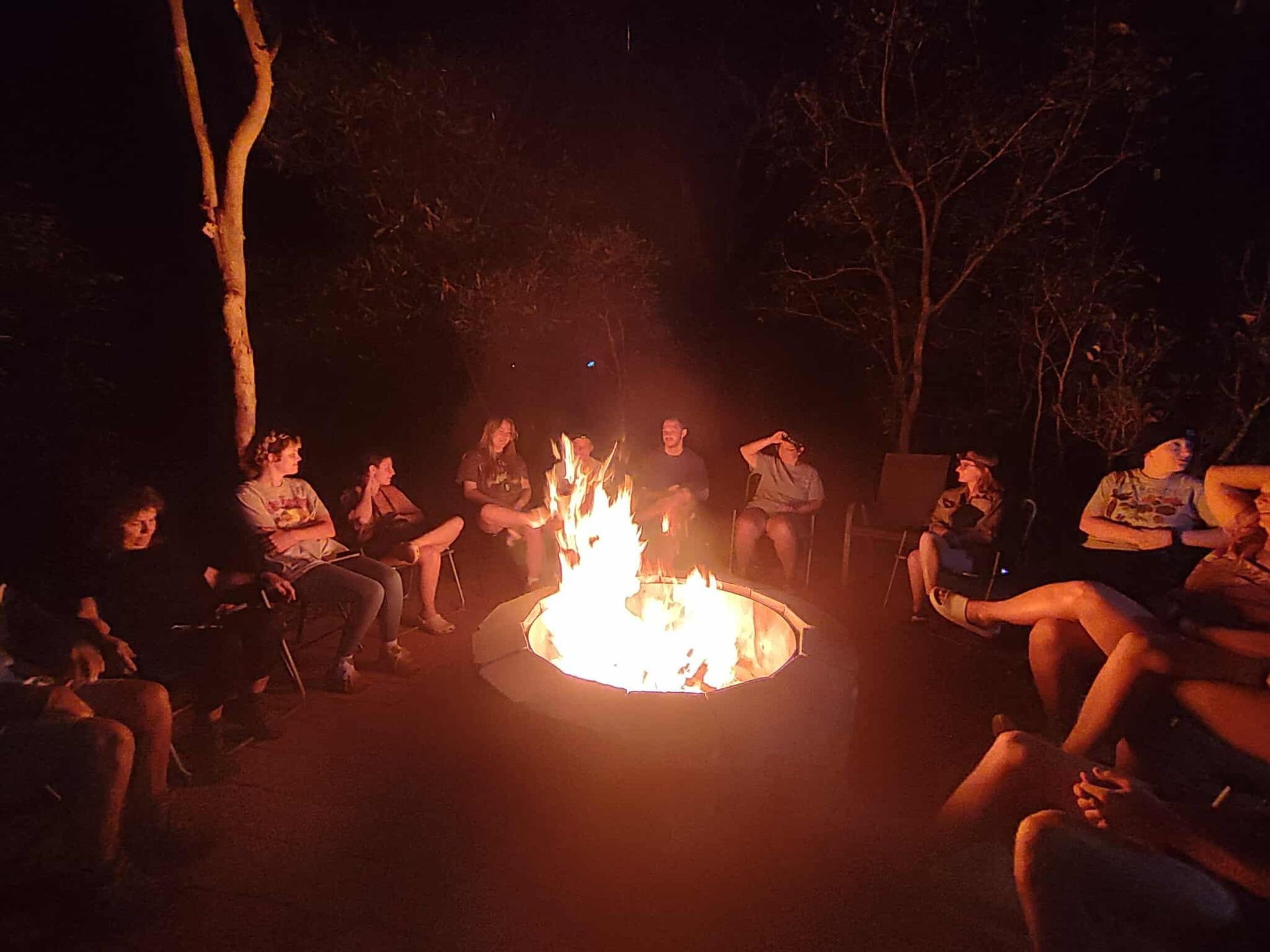 A Group Of Guests Around A Camp Fire- Nina's Ark Wildlife Sanctuary In Finniss Valley, NT