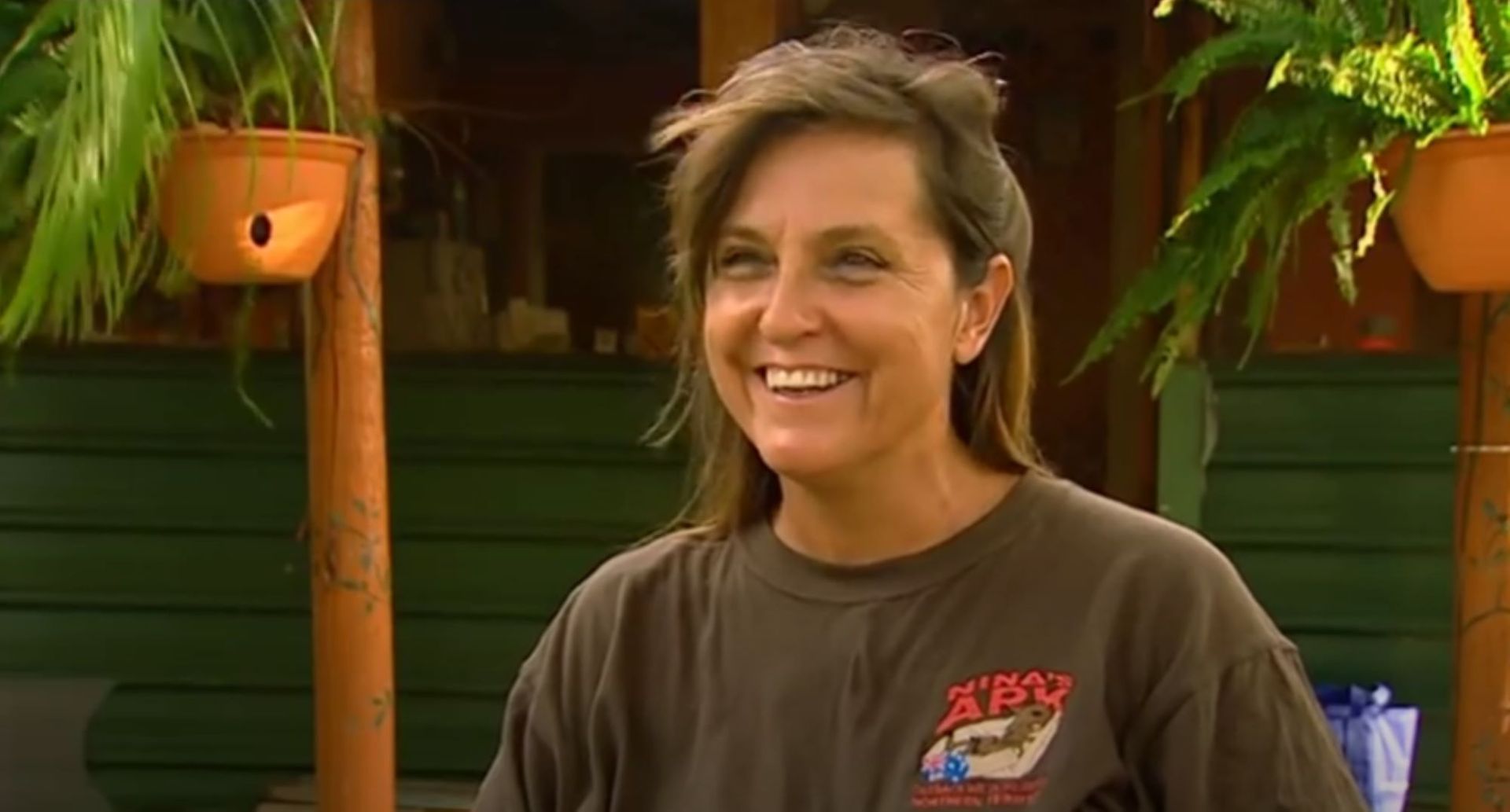 A Woman in a Brown T-shirt is Smiling — Nina's Ark Wildlife Sanctuary In Finniss Valley, NT