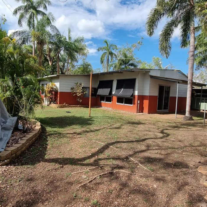 A Red and White House With Palm Trees in the Background — Nina's Ark Wildlife Sanctuary In Finniss Valley, NT