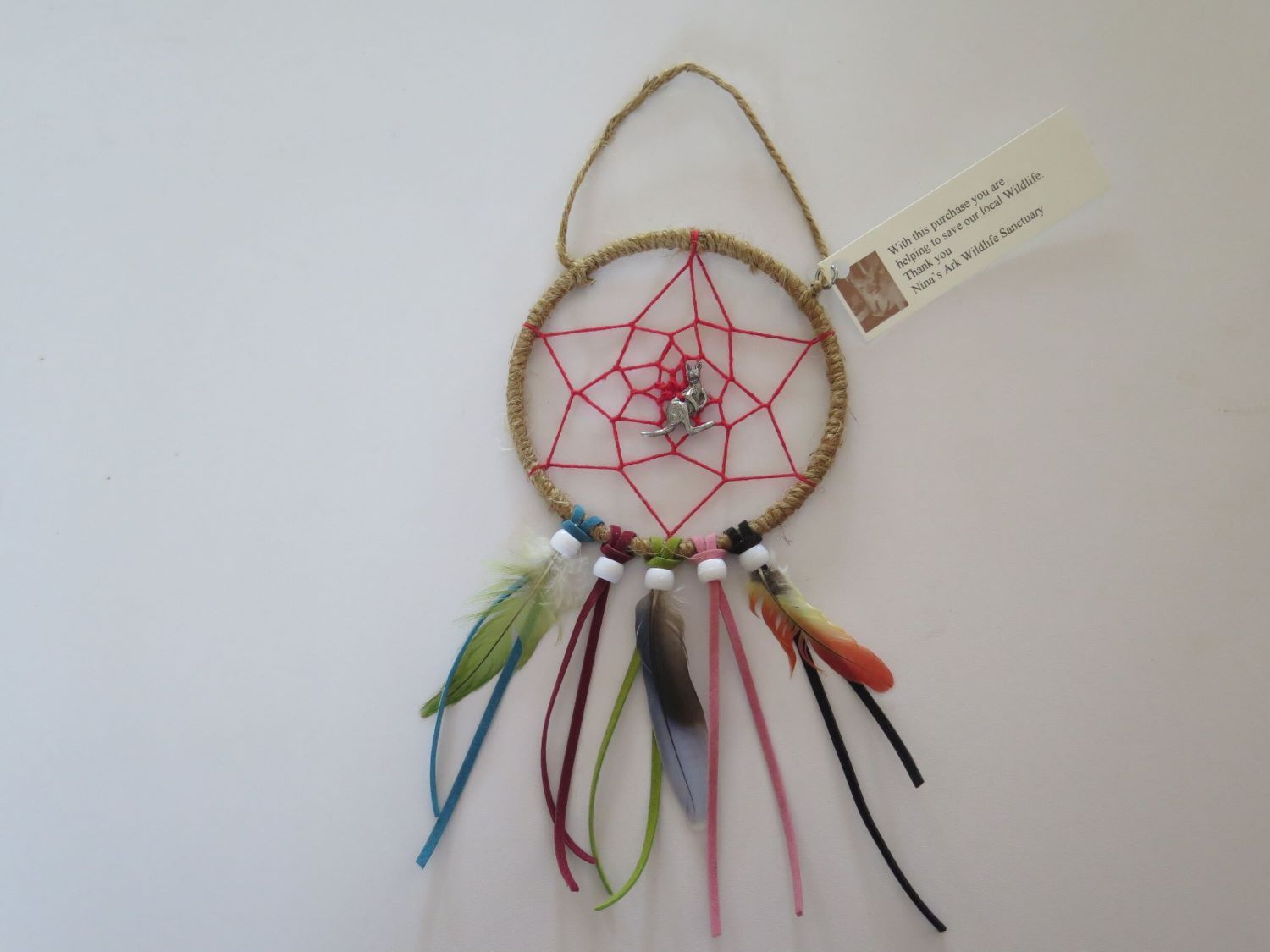 A Colorful Dream Catcher With a Tag Attached to It — Nina's Ark Wildlife Sanctuary In Finniss Valley, NT