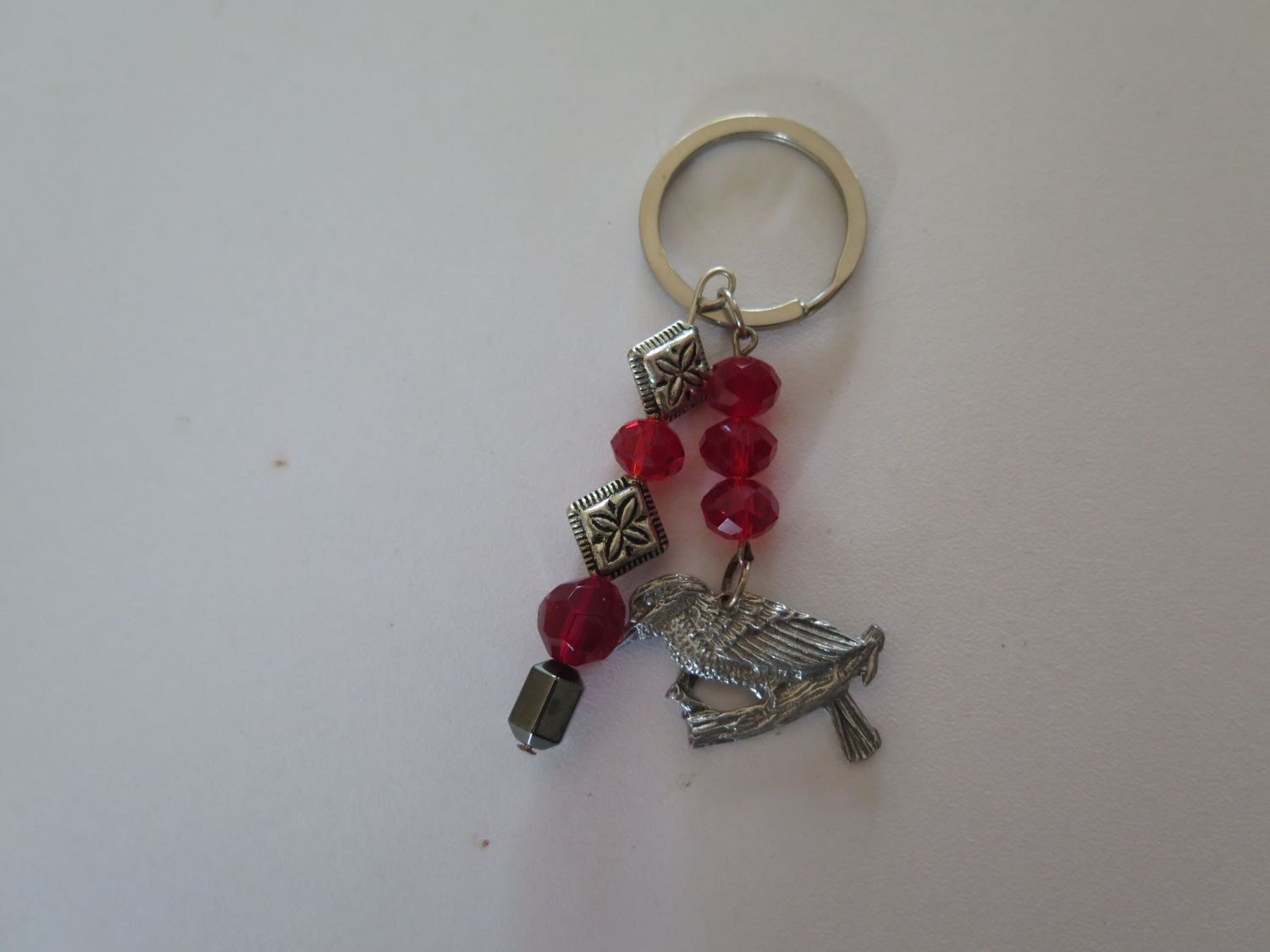 A Key Chain With Red Beads and a Deer Charm — Nina's Ark Wildlife Sanctuary In Finniss Valley, NT