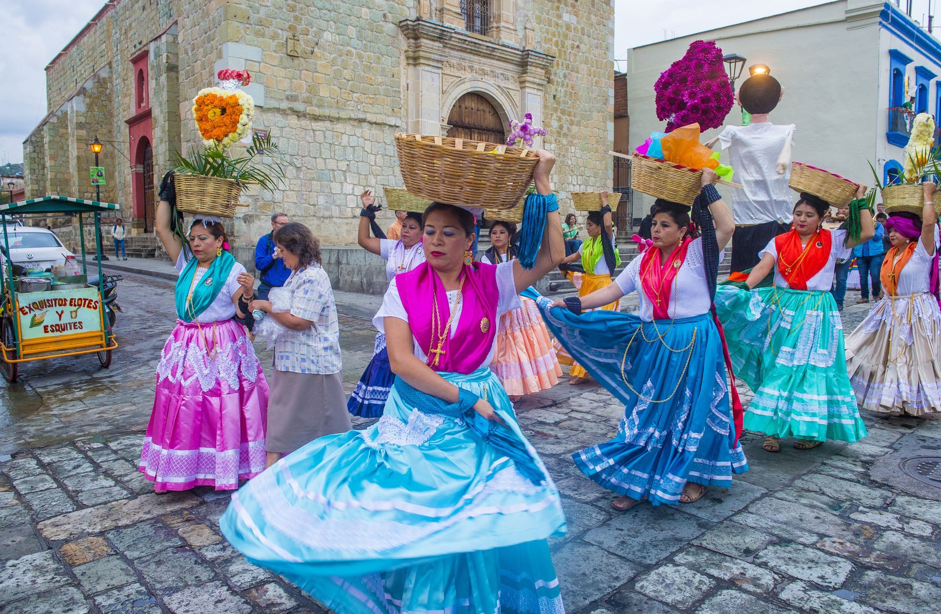 Group celebrating Día de los Muertos in Mexico — traditional face paint, costumes, and cultural festivity.