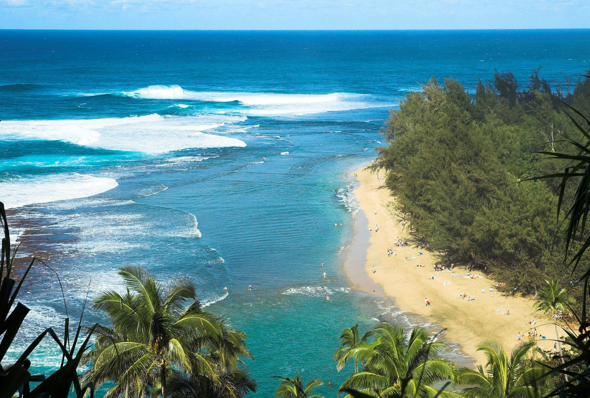 Spacious modern living room with dining area, beige and gray tones, large windows, and a colorful rug.