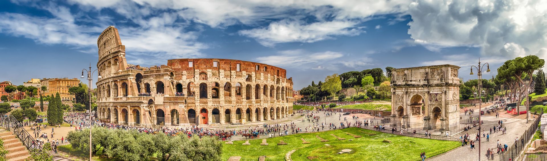 Ancient Colosseum ruins in Rome, Italy under sunny skies, featured in a historical Europe itinerary by Latitude & Leisure