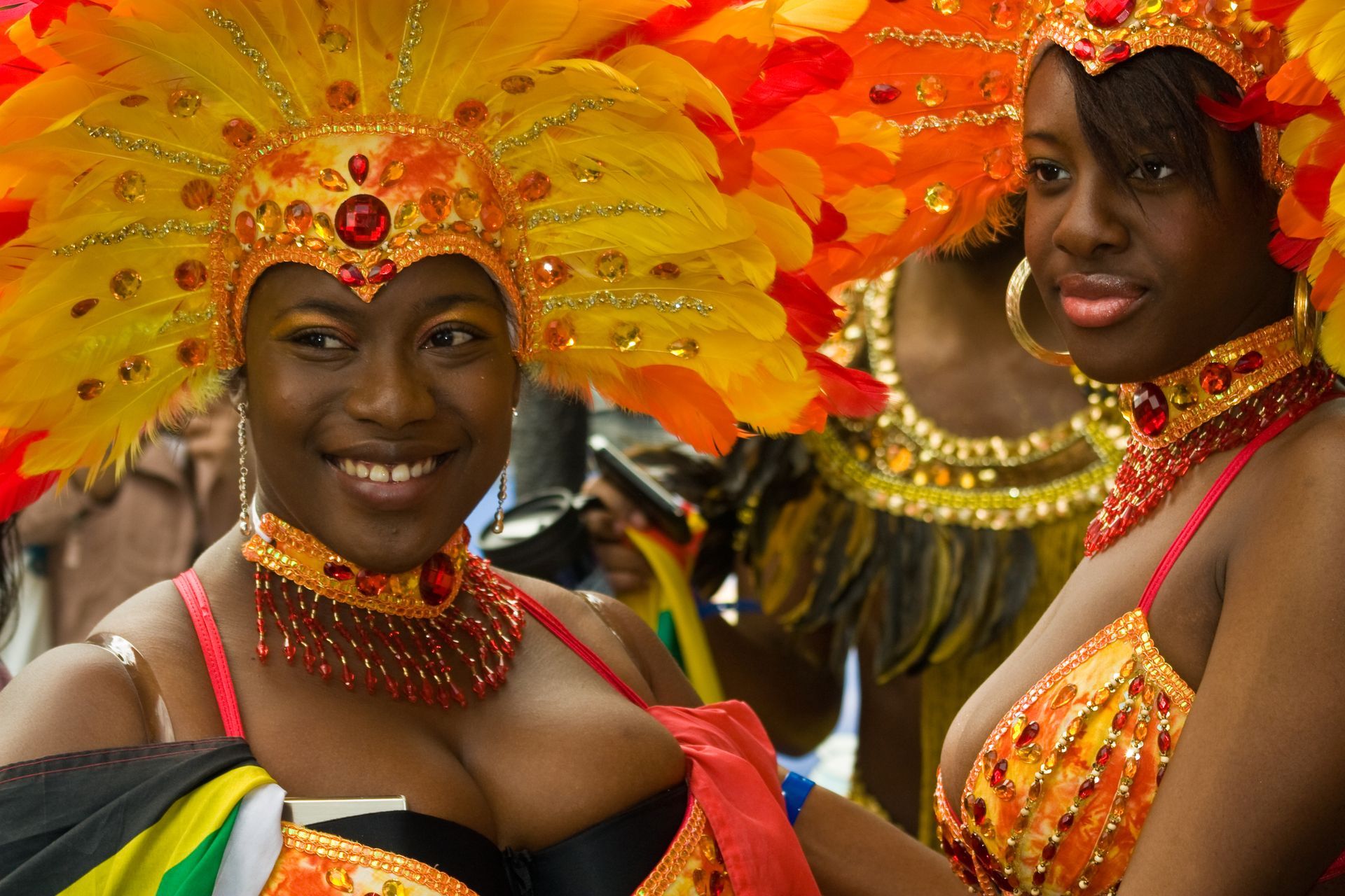 Spacious modern living room with dining area, beige and gray tones, large windows, and a colorful rug.